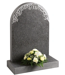 Humbleton Norman round shape, South African Dark Grey granite. Decorative Celtic lettering in a part honed ‘churchyard’ finish.